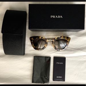 Prada: Tortoiseshell Havana Cat eye Sunglasses